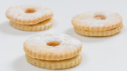 Mini cookies with flavors on white background