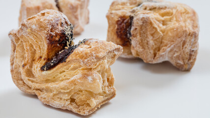 Mini cookies with flavors on white background