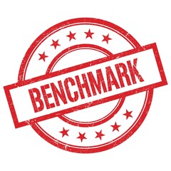 BENCHMARK text written on red vintage round stamp.