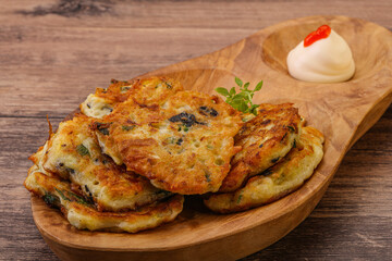 Zucchini pancakes with herbs and spices