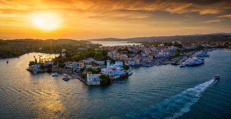 Fototapeta na wymiar Panoramic view to the town of Porto Cheli, Greece, a famous high society retreat at the Peloponnese peninsula during an intense summer sunset
