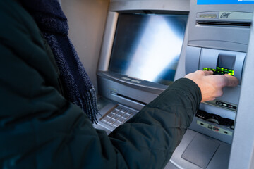 Man taking money out of an ATM
