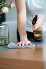 woman cleaning the table