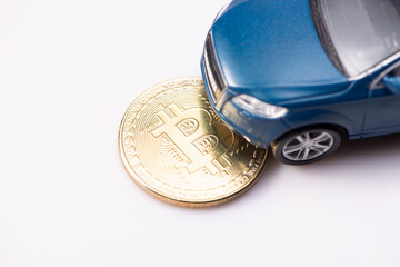 Luxurious and expensive blue suv toy car bought thanks to the Bitcoin cryptocurrency. Isolated on white background. Top view