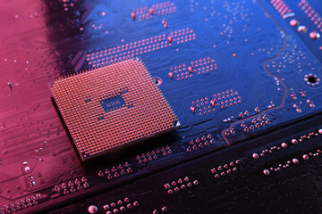 Computer cpu processor chip on circuit board ,motherboard background. Close-up. With red-blue...