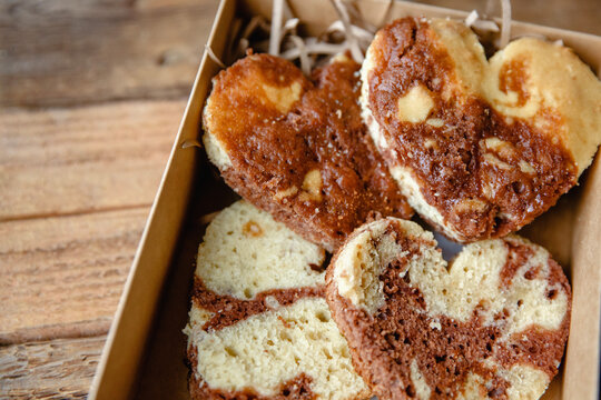 Heart-shaped buns in an open craft box close-up. Valentine's Day Gift