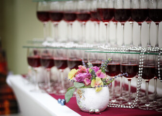 glasses decorated with flowers. Luxury table for a Banquet. Table set for a party
