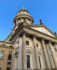 Fototapeta na wymiar Low angle view of The French Church of Friedrichstadt in Berlin Germany