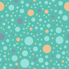 Round blue and purple shapes on  light turquoise background. Seamless abstract simple pattern. Suitable for wrapping paper, textile.