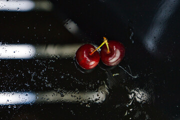 cherries on a black background