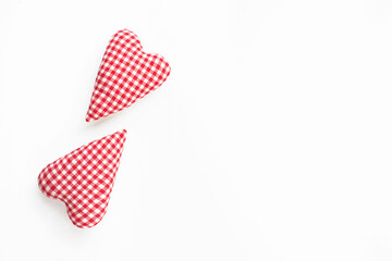 Valentines day composition. Two soft red hearts on white background. Flat lay, top view, copy space
