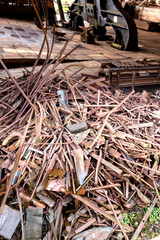 Scrap metal piled outside a factory warehouse.  Recycling concept