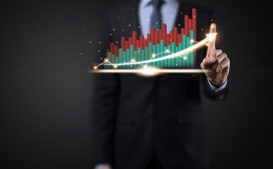 Businessman on a black background presses, presses a finger on a positive growth arrow. Graphs of indicators. Business development and finance concept