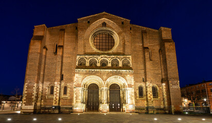The Basilica of Saint Sernin illuminated at night, in Toulouse in Occitanie, France