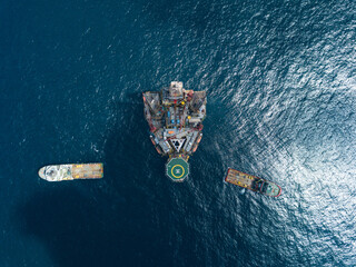 Offshore jack up rig and tow vessels during the rig move operation at the offshore location