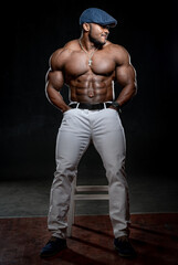 Obraz na płótnie Canvas Full size portrait of muscular bodybuilder man on black background. Handsome sportsman afro american.