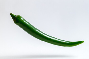 green chili peppers, chili flaying on a white background