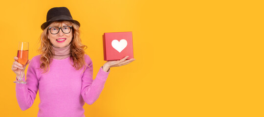 woman holding gift box with valentine heart