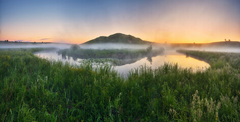 Beautiful spring sunrise over river banks