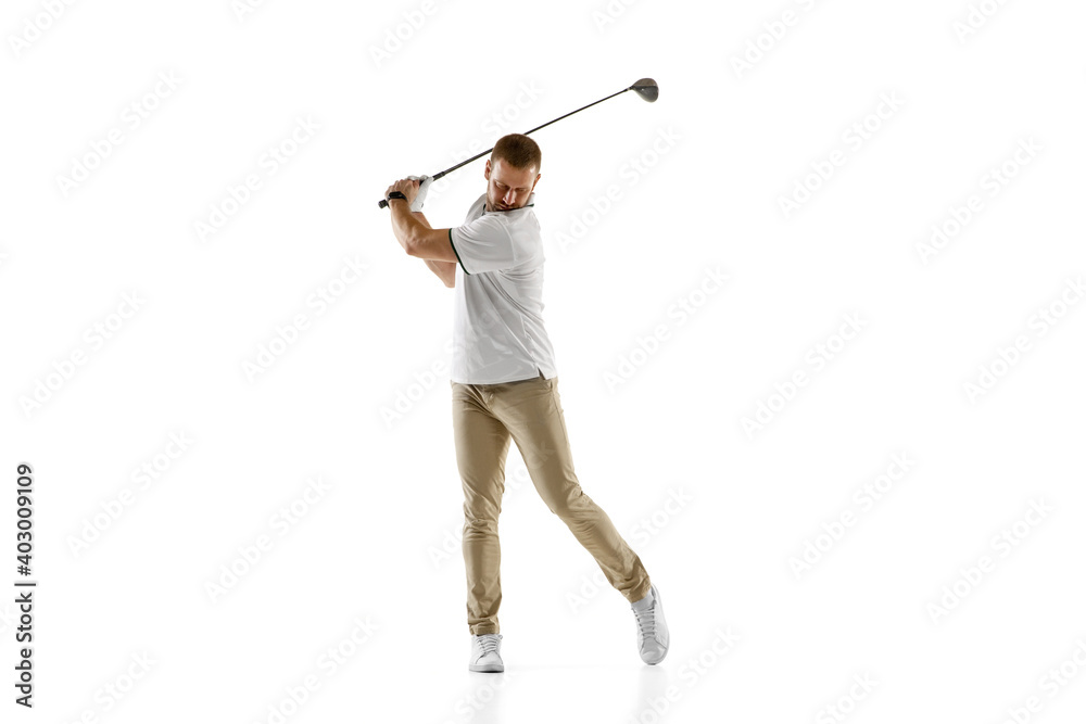 Wall mural Impressed. Golf player in a white shirt taking a swing isolated on white studio background with copyspace. Professional player practicing with bright emotions and facial expression. Sport concept.