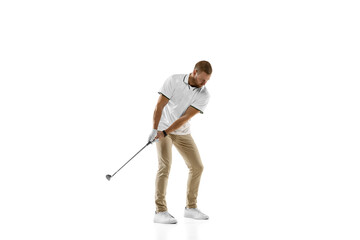 Balance. Golf player in a white shirt practicing, playing isolated on white studio background with copyspace. Professional player practicing with bright emotions and facial expression. Sport concept.