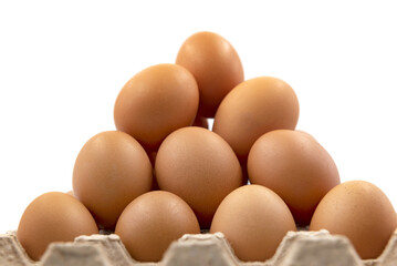 Chicken eggs in an organic box on a white background close-up. Easter

