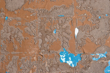 Rough brown wall texture with pieces of glue and stucco in place of old tile. Perfect for background and design.
