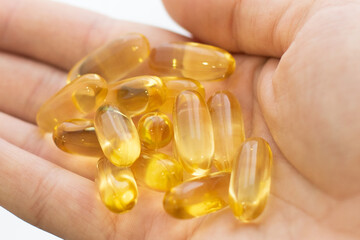 Fish oil pills capsules tablets omega 3 healthy diet concept