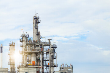 Industrial of oil refinery plant from industry zone ,Refinery factory oil storage tank and pipeline steel with blue sky.