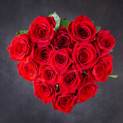 Bouquet of red roses.  Beautiful flowers on a black background. Top view.