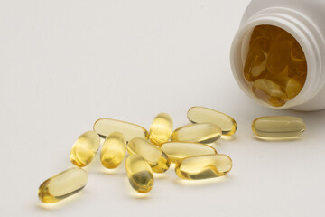 Holds Vitamin D Supplements omega 3 healthy diet concept