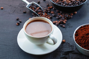 Obraz na płótnie Canvas .Roasted coffee beans with coffee powder and coffee cups.