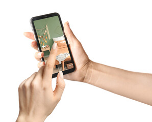 Woman holding modern mobile phone with stylish interior of bedroom on screen against white background