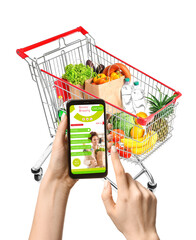 Shopping cart with products on white background