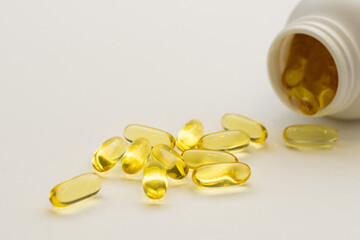 Holds Vitamin D Supplements omega 3 healthy diet concept