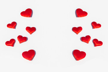 frame of red small hearts on white background