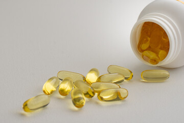 Fish oil pills capsules tablets omega 3 healthy diet concept