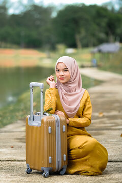 Muslim Woman In Traditional Wear Holding Luggage