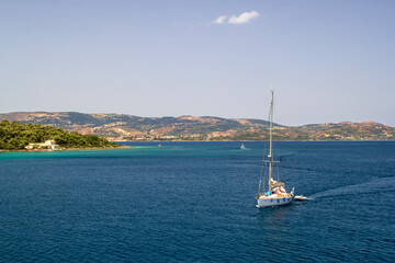 yacht sailing out of Argostoli with beautiful hills in background