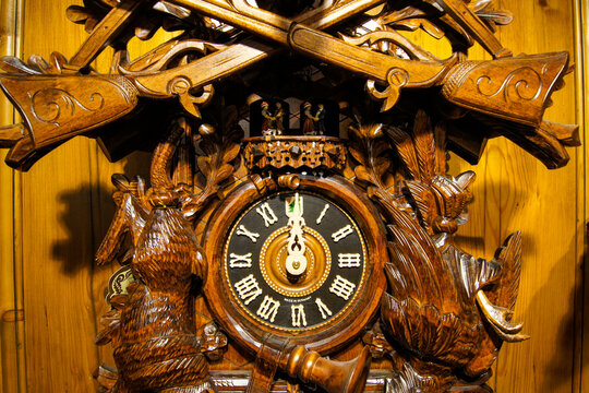 Close-up of a wooden, handcarved cuckoo clock made in Germany.