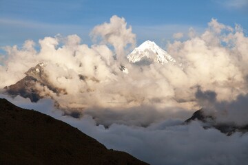 Fototapeta na wymiar Evening view of Mount Salkantay in the middle of clouds