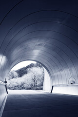 exit of futuristic tunnel in black and white