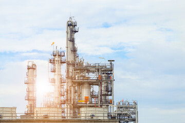 Industrial of oil refinery plant from industry zone ,Refinery factory oil storage tank and pipeline steel with blue sky.