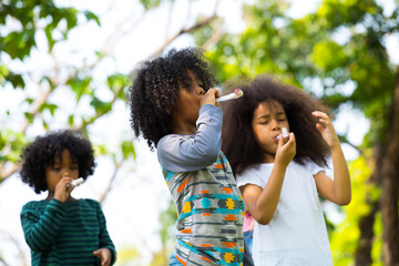 Group of Diverse Kids Playing at the garden Together