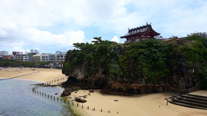 Shrine temple on the cliff above the beach in Naha, Okinawa, Japan 
