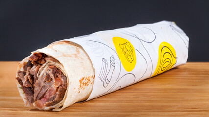 Shawarma menu with french fries on wood, in Amman