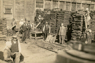 RUSSIA - CIRCA 1920s: Vintage archive photo of business owners managers and workers in rail sleepers factory. Sawmill