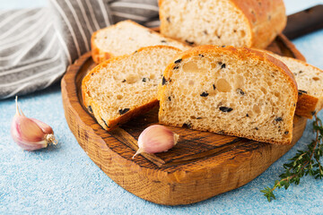 Homemade Italian ciabatta bread with herbs, garlic and olives