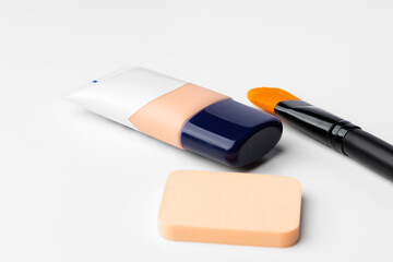 Make up liquid foundation with brush on white background