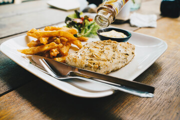 Grilled ckicken breast steak with potato and vegetable